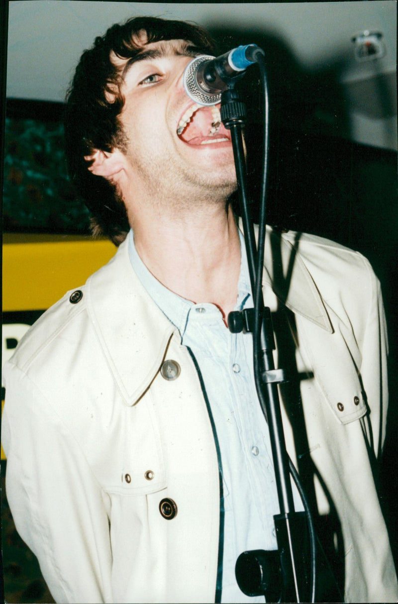 Liam Gallagher of rock band, oasis in action at a secret free gig at the Virgin Megastore in London. - Vintage Photograph