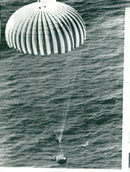 Using the parachute, the Gemini 11 capsule slowly descends towards the Atlantic Ocean beyond the Bermuda islands - Vintage Photograph