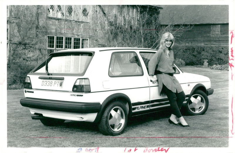 A woman with Volkswagen Alpine Golf. - Vintage Photograph