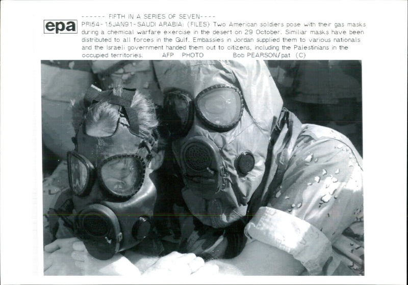 Iraq war pow:two american soldiers poest with their as mask. - Vintage Photograph