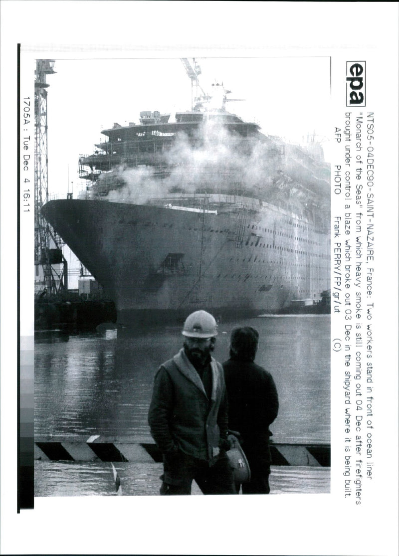 Monarch of the seas: two worker stand in front if ocean. - Vintage Photograph