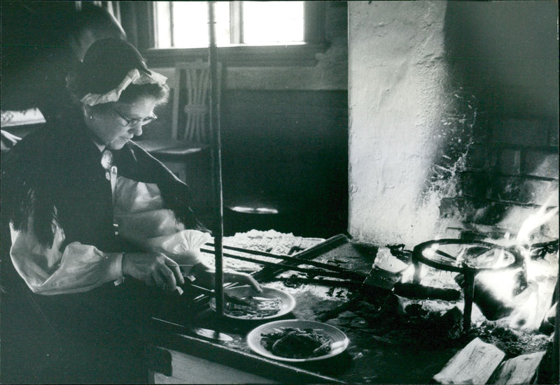 Woman baking in front of Christmas market - Vintage Photograph