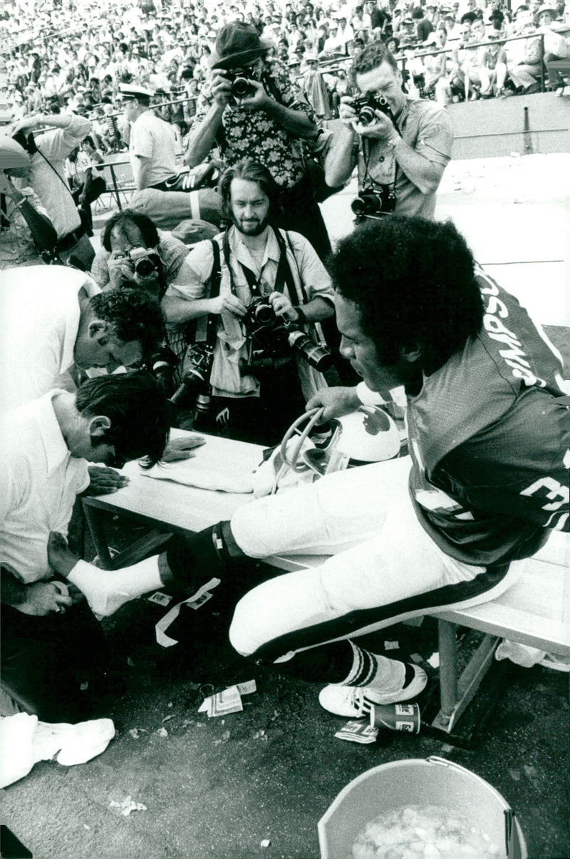 O. J. Simpson on the bench for a special tape job - Vintage Photograph