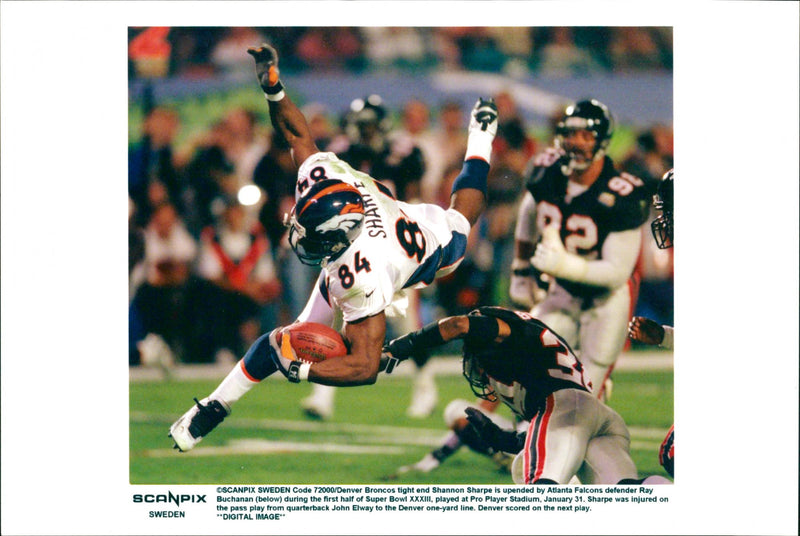 American Football - Sharpe was injured on the pass play from quarterback John Elway. - Vintage Photograph