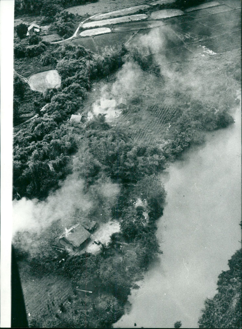 The War in Vietnam, U.S. Planes Bomb Village - Vintage Photograph