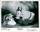 Fievel and Tanya, the protagonists from the animated film "An American Tail," are told by their Papa that they will be going to America. - Vintage Photograph
