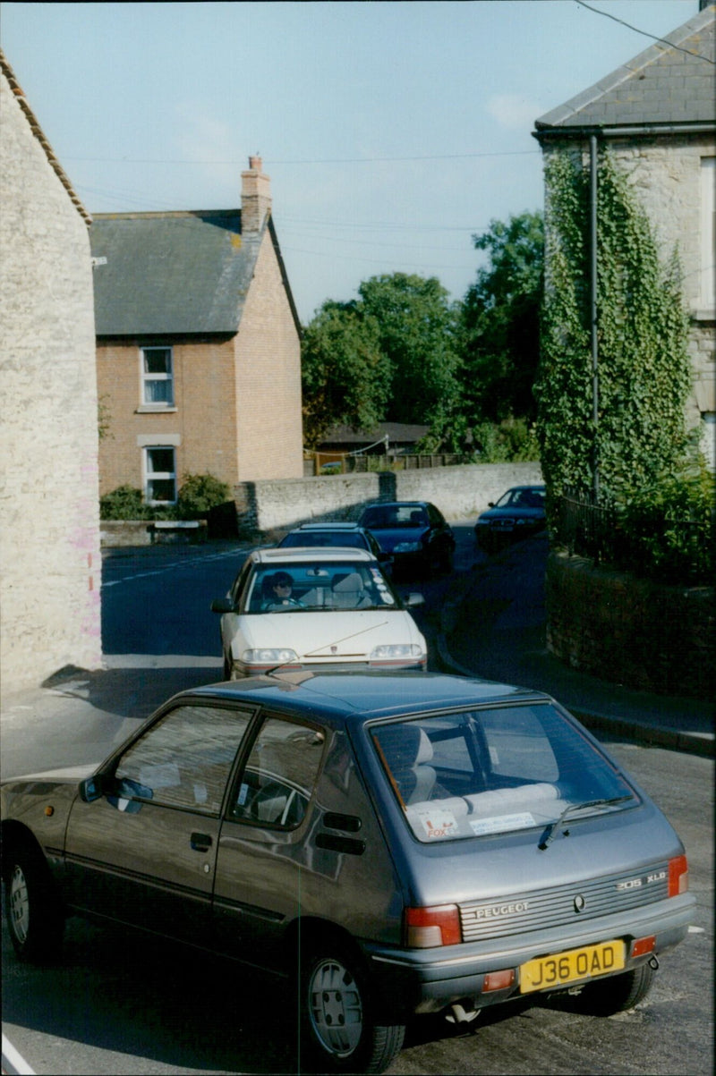 Traffic congestion caused by a Peugeot 205 XLD near Islip, UK. - Vintage Photograph