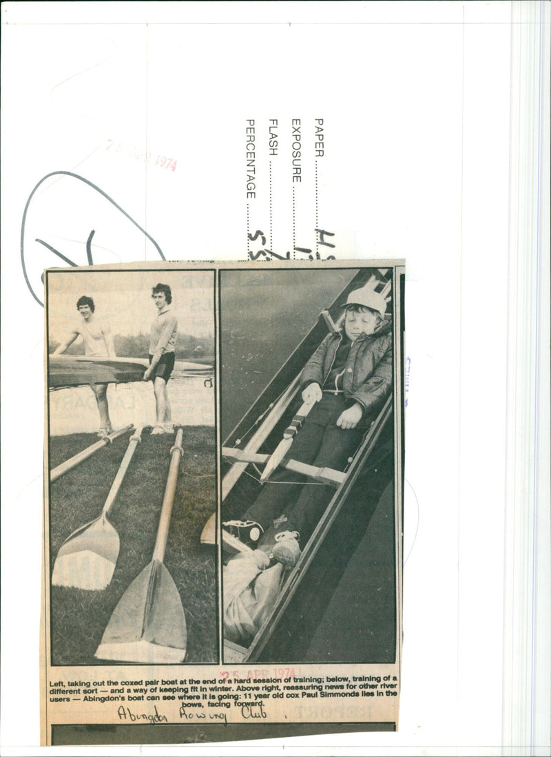 Abingdon Rowing Club members take out a boat after a training session and 11 year old Paul Simmonds takes control of the boat. - Vintage Photograph
