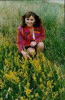 Conservationist Jessica Rea inspects Ladies Bedstraw at Wigwell's Wildlife Nature Reserve in Charlbury. - Vintage Photograph