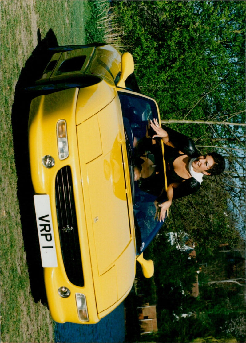 Classic and Sports Car enthusiast Debbie Currie tries out a Ferrari F355 Spider. - Vintage Photograph