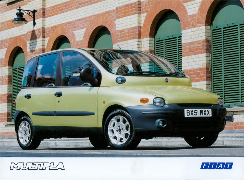 A Fiat Multipla vehicle driving on a city street. - Vintage Photograph