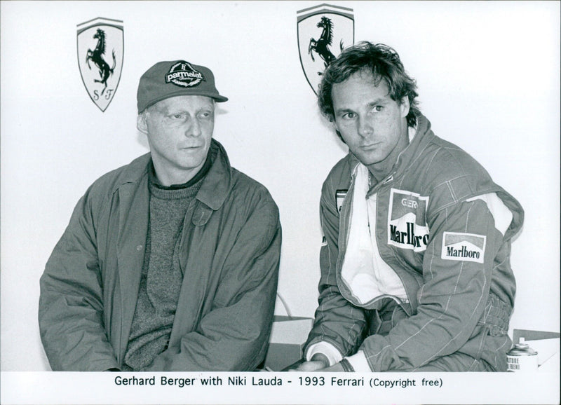 Gerhard Berger of Marlboro Team Ferrari with former Formula 1 driver Niki Lauda. - Vintage Photograph