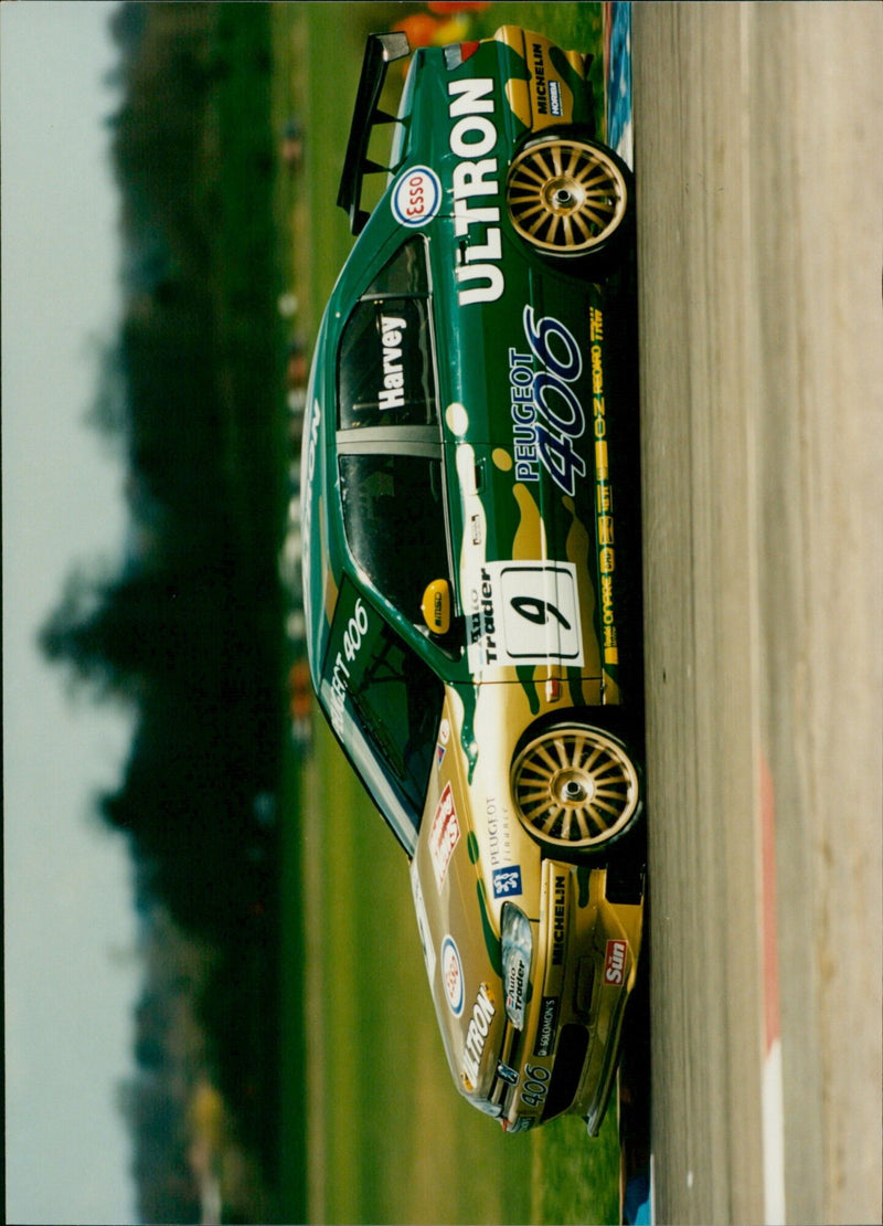 Tim Harrey, driver of a Peugeot 406 EAuto, takes a lap of the Esso Ultront, Michelin Sun, and Horiba track. - Vintage Photograph