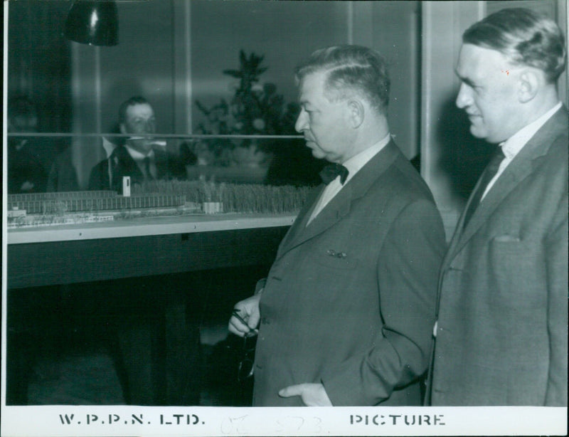 Professor Jacobson and Alan Bullock examine a model of the proposed St. Catherine's College in London. - Vintage Photograph