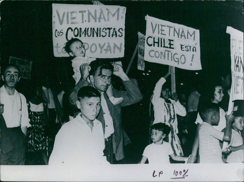 Hundreds of protesters in Santiago, Chile, demand an end to U.S. involvement in the Vietnam War, voicing their solidarity with the people of Vietnam. - Vintage Photograph