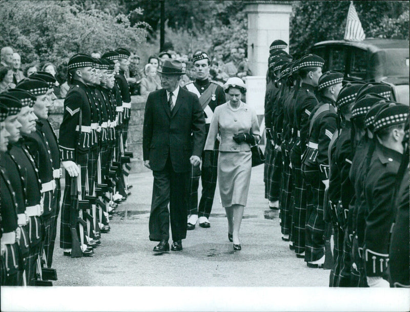 Queen Elizabeth II smiles during a visit to the Bal des Invalides in Paris. - Vintage Photograph