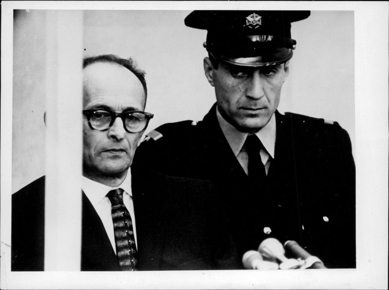 Nazi Adolf Eichmann photographed during the trial in Jerusalem where he was convicted of the death of war crimes and massacres during WWII. - Vintage Photograph