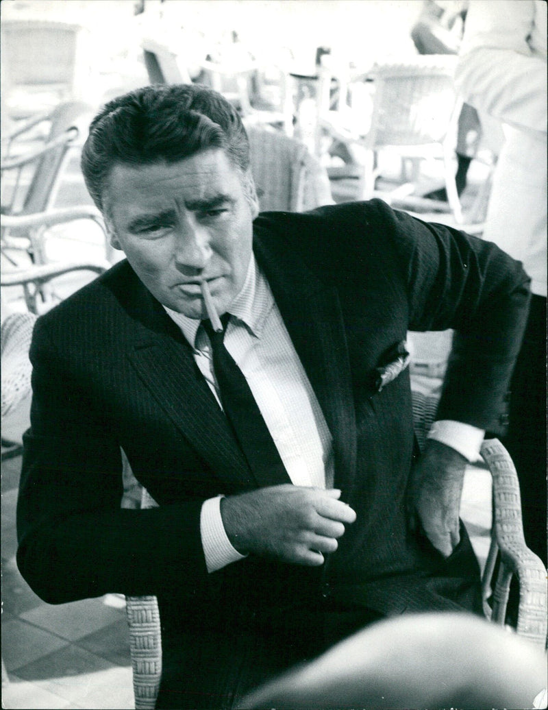 Peter Lawford, brother-in-law of President John F. Kennedy, poses for a photograph in Stockholm, Sweden on May 8, 1961. - Vintage Photograph