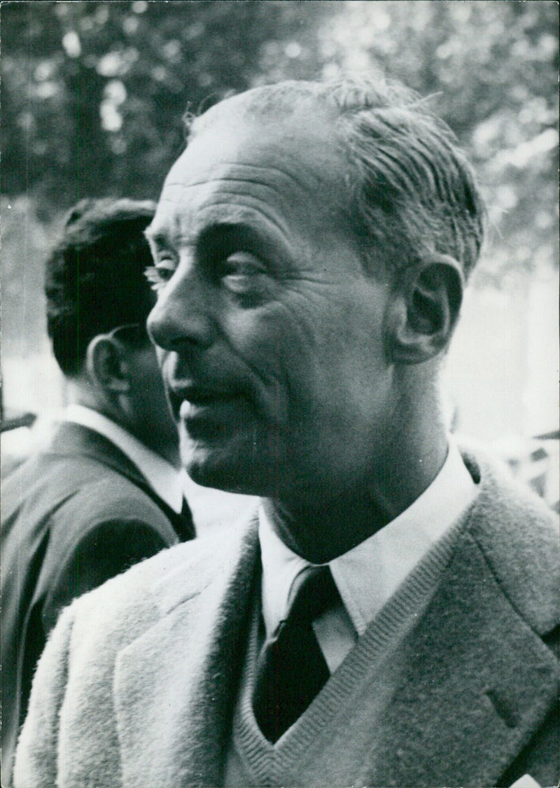 Baron Guy de Rothschild, a member of the renowned European banking family and one of France's leading racehorse owners, is pictured at Torsgat, 11 Stock. - Vintage Photograph