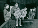 Prince Rainier, Princess Grace, and their children Albert, Caroline, and Stephanie enjoy the sunny weather in the Swiss Alps. - Vintage Photograph