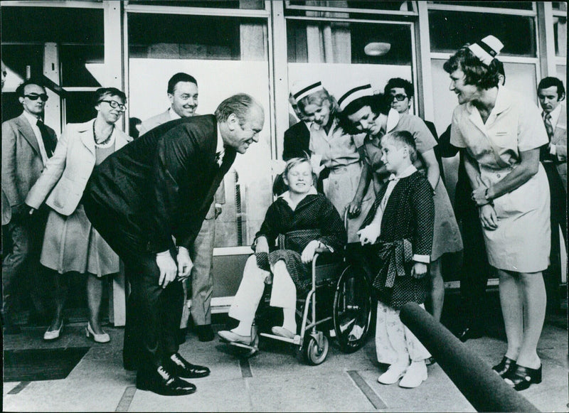 US President Gerald Ford visits a children's hospital in Cracow, Poland, during his official two-day visit in July 1975. - Vintage Photograph