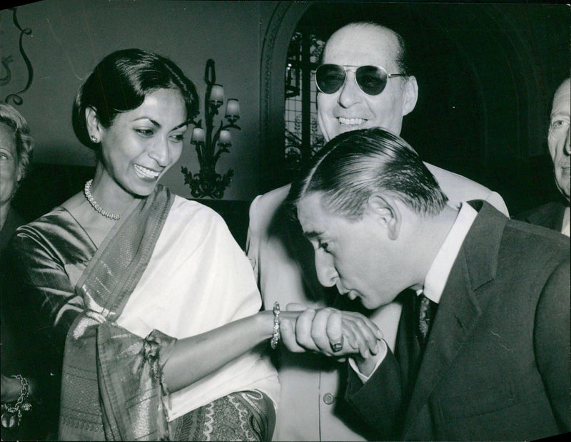 Sonali Das Gupta receives a hand-kiss from Italian comic and actor Rena To Rascel at the 12th International Film Festival in Cannes, France - Vintage Photograph