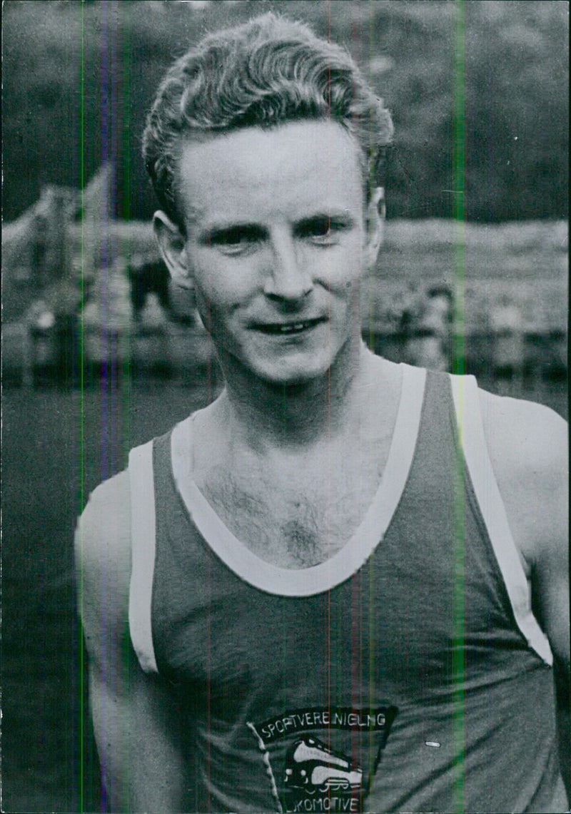 East German Athlete Klaus Richtzenhain competing in the 500 meters race at White City, London - Vintage Photograph