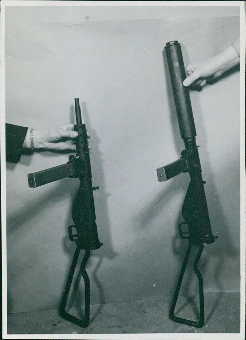 A machine gun with a sound suppressor used by Norwegian saboteurs. - Vintage Photograph