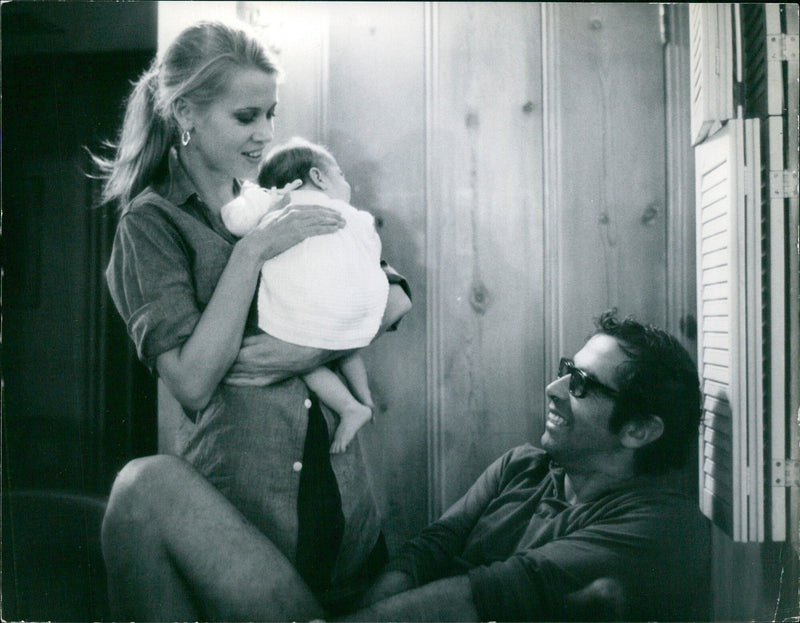 Roger Vadim and his wife photographed in their new home in Malibu, California, with their daughter Vanessa. - Vintage Photograph