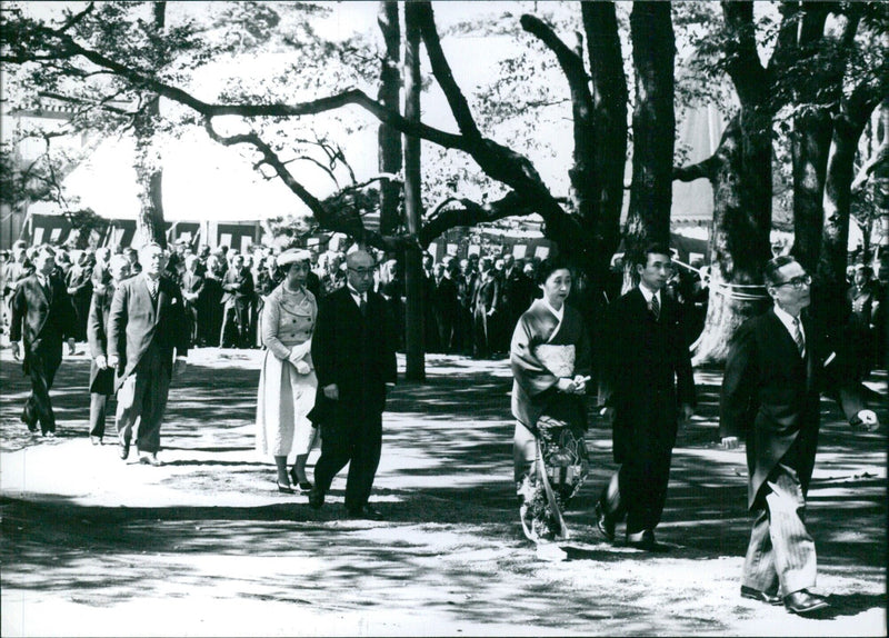 Guests walking through Imperial Palace park to wedding ceremony - Vintage Photograph