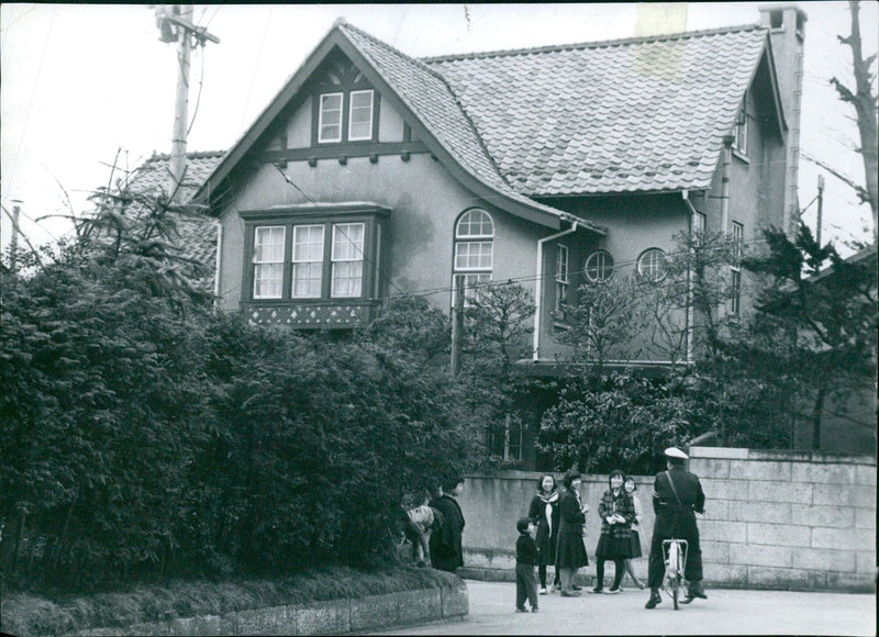 Police guard talking to school girls outside Michiko's house - Vintage Photograph