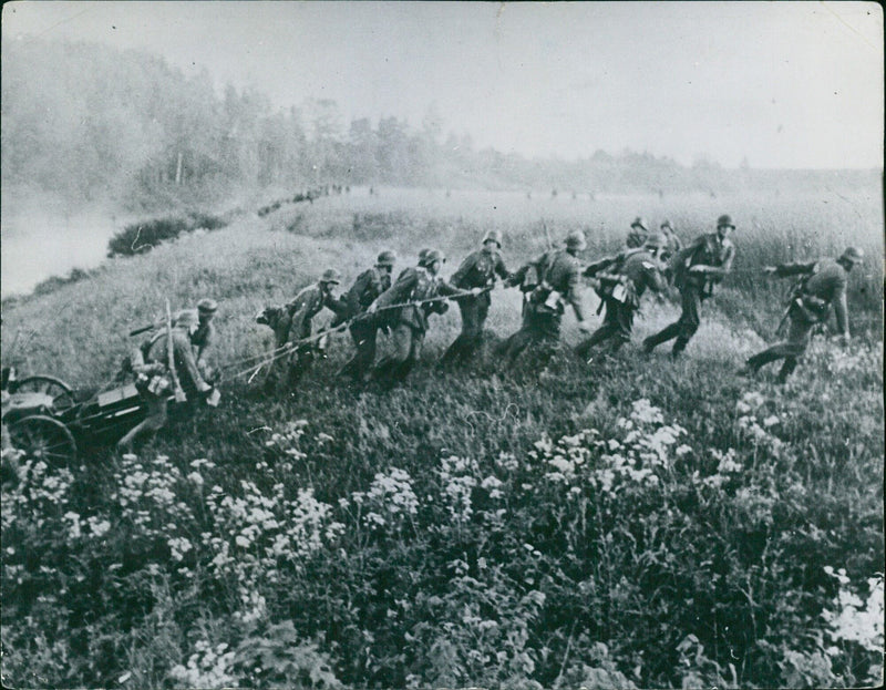 German soldier drags a cannon to the shore - Vintage Photograph