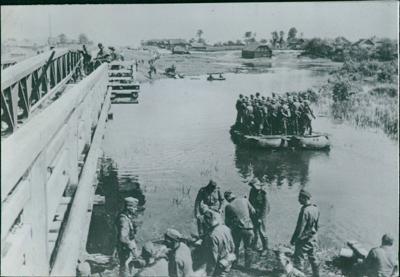 German soldiers crossing the river with makeshift bridges - Vintage Photograph