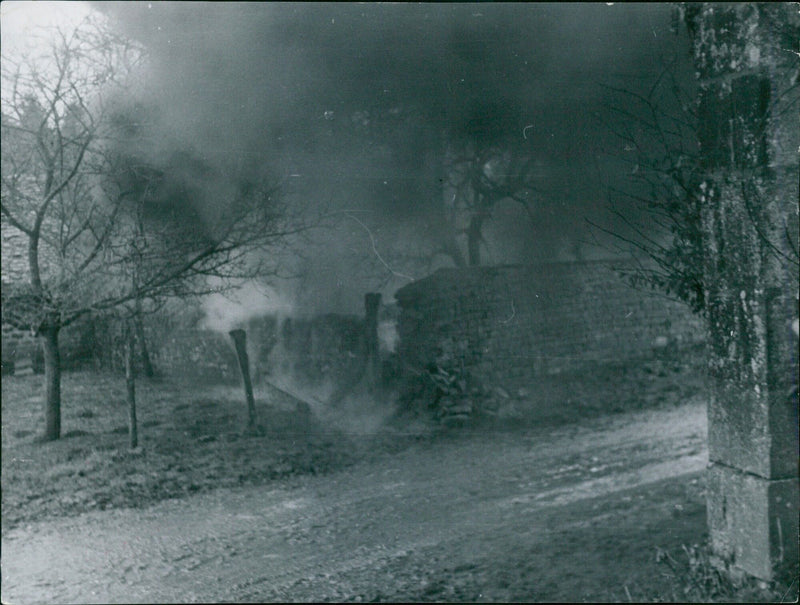 The burning village is behind the German troops - Vintage Photograph