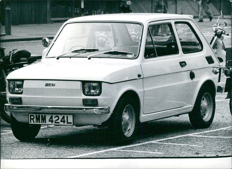 The Italian newcomer FIAT 126. Fractionally narrower than the mini, this car is now the smallest on the British market. - Vintage Photograph