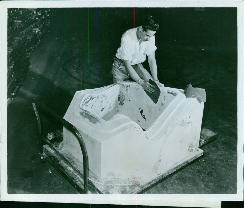 Workman finishing touches on plastic die - Vintage Photograph