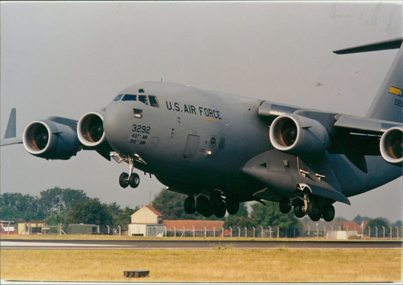 A c17 comes in to land at RAF Mildenhall. - Vintage Photograph