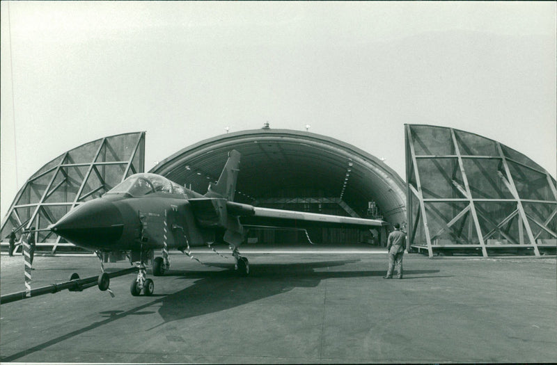 A plane near its parking area. - Vintage Photograph