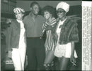 Joe Frazier with Debra Youngblood and Gigi Brown. - Vintage Photograph