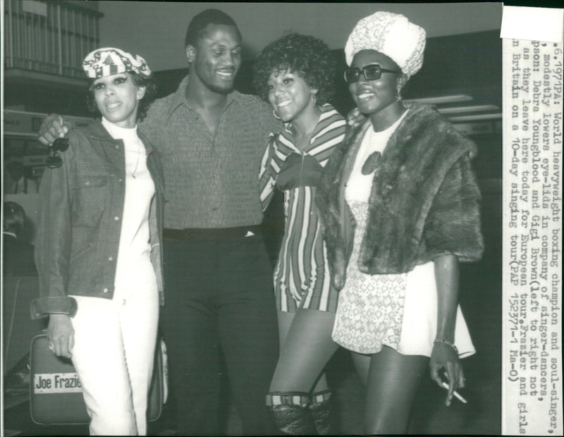 Joe Frazier with Debra Youngblood and Gigi Brown. - Vintage Photograph