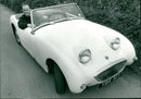 Michael Pentland at the wheel of his frog-eye sprite. - Vintage Photograph