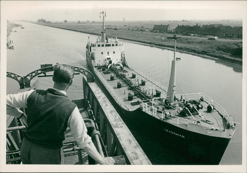 Mr hodge watches as the oil tanker leads man . - Vintage Photograph