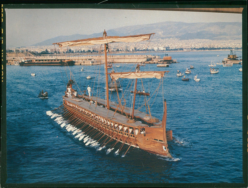 View of Ships on the Sea Paddled by Group of People. - Vintage Photograph