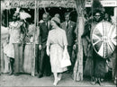 Queen Elizabeth leaving the West Suk Tribes section at the West Kenya show. - Vintage Photograph