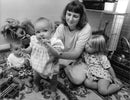 Hannah Langlands tries her hand at music with mum Stella, sister Jessica and friend. - Vintage Photograph