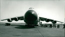 Americans file into Lockheed C-5 Galaxy at RAF Marham - Vintage Photograph