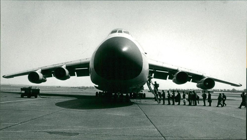 Americans file into Lockheed C-5 Galaxy at RAF Marham - Vintage Photograph