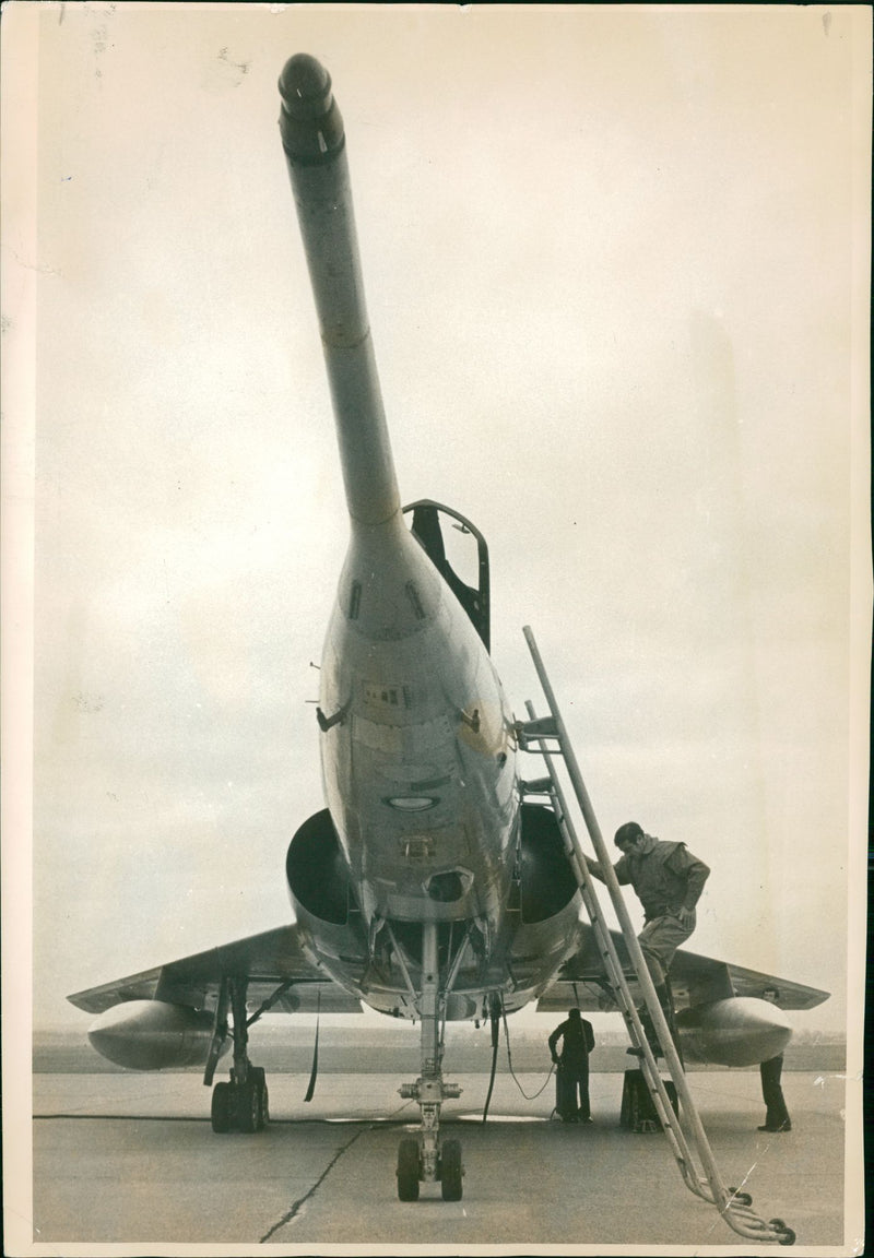 ONE of the crew of the french mirage IV jet seen leaving the aircraft at R.A.F. marham yesterday - Vintage Photograph