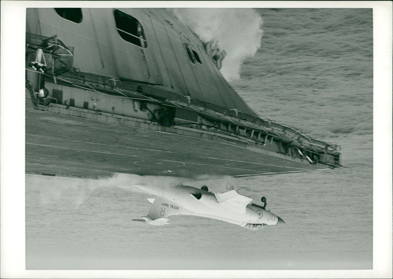 aircraft of No 801 Saundron, leet Aix Arn is shot trom the iight deck by the starboard ateann catapuit on board the aireraftmcarrier HMS Ark Royal. - Vintage Photograph