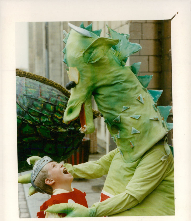 Open-mouthed Richard Catton, meets Cedric, the dragon at the entrance to Norwich Castle. - Vintage Photograph